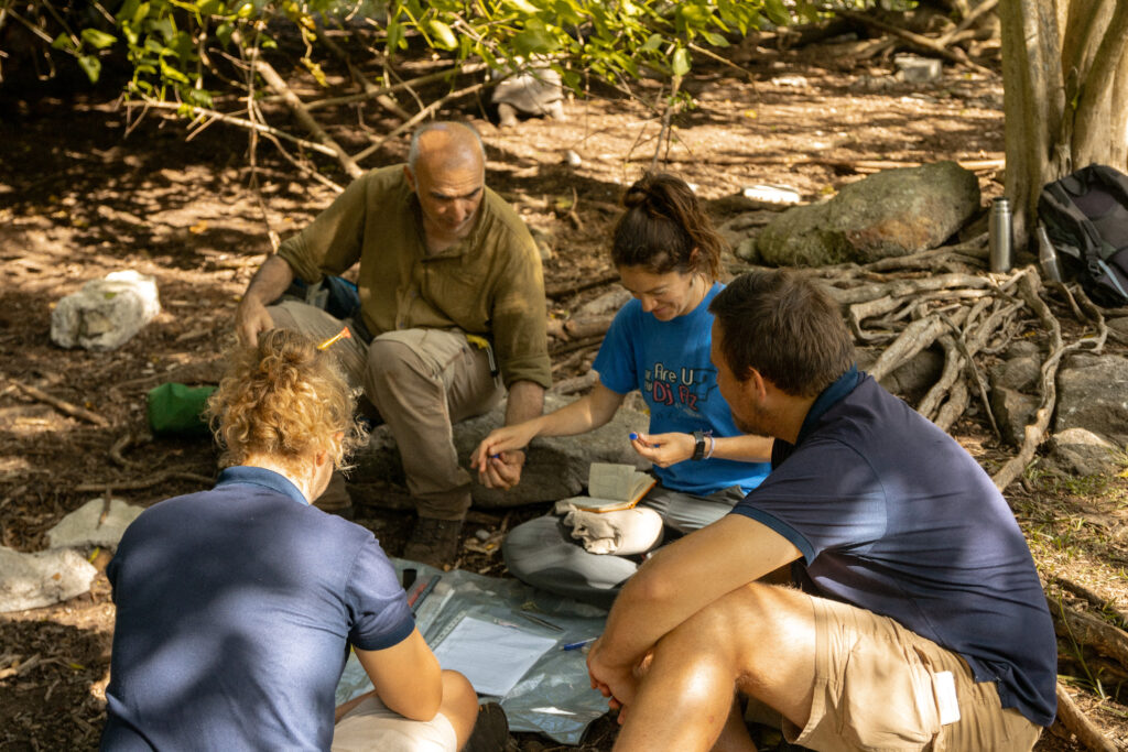 Researchers sharing their knowledge with conservation team about the island biodiversity.